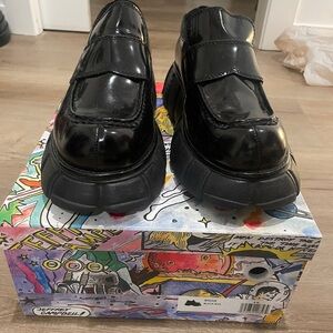 Black platform loafers